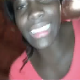 A black girl takes a huge, long shit on the floor and gives us a view of her mess.